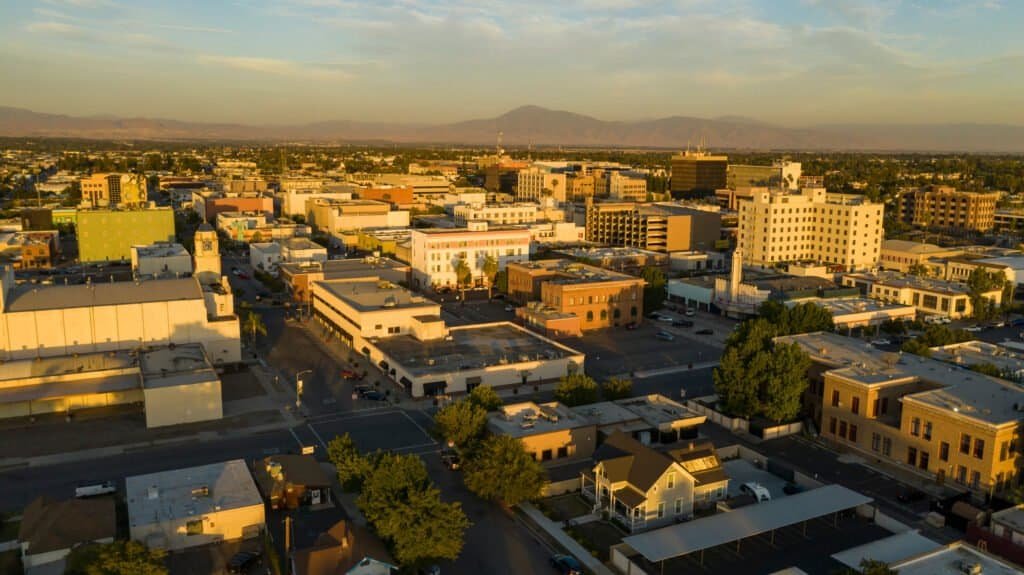 The southern city center downtown area of bakersfield aerial view illuminated by late afternoon light