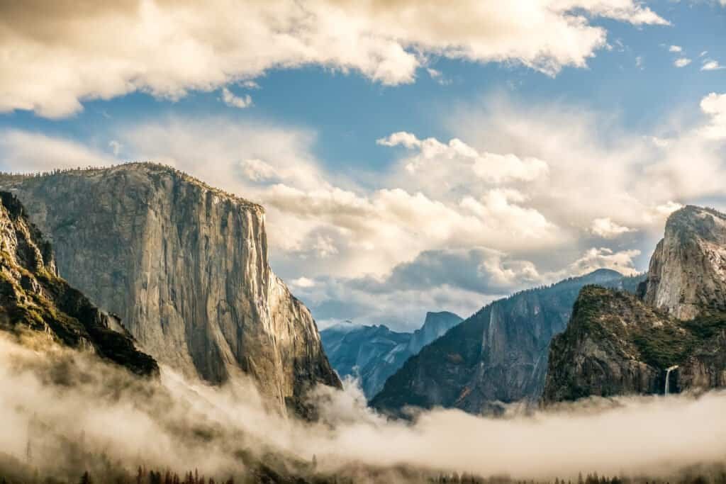 Yosemite national park valley at cloudy autumn morning from tunnel view. Low clouds lay in the valley. California, usa.