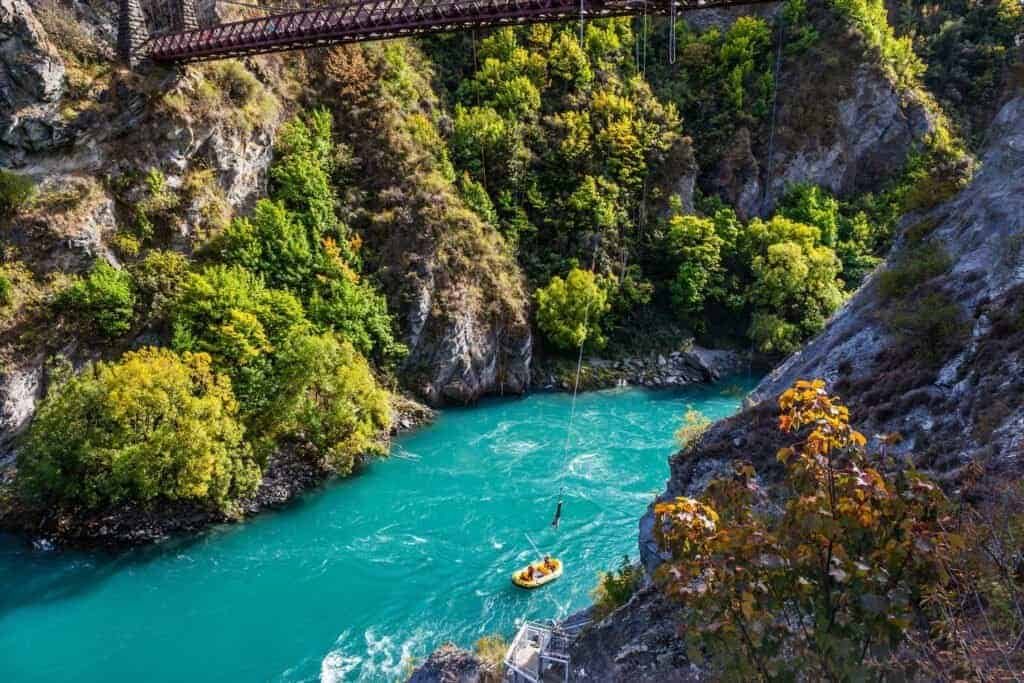 A picturesque river in a mountain gorge. Attraction bungee jumping on a bridge over a mountain river.