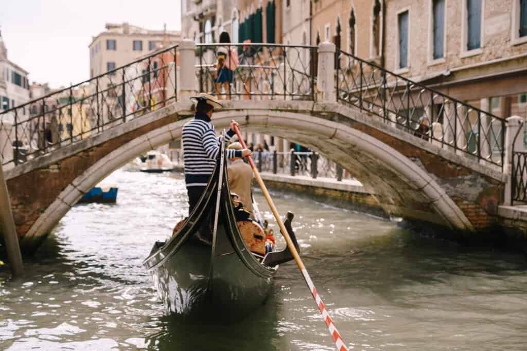 Gondola along a narrow venetian canal