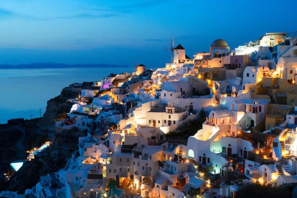 Lights of oia village at blue night, santorini greece