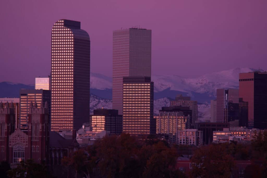 Denver skyline snow covered mountains