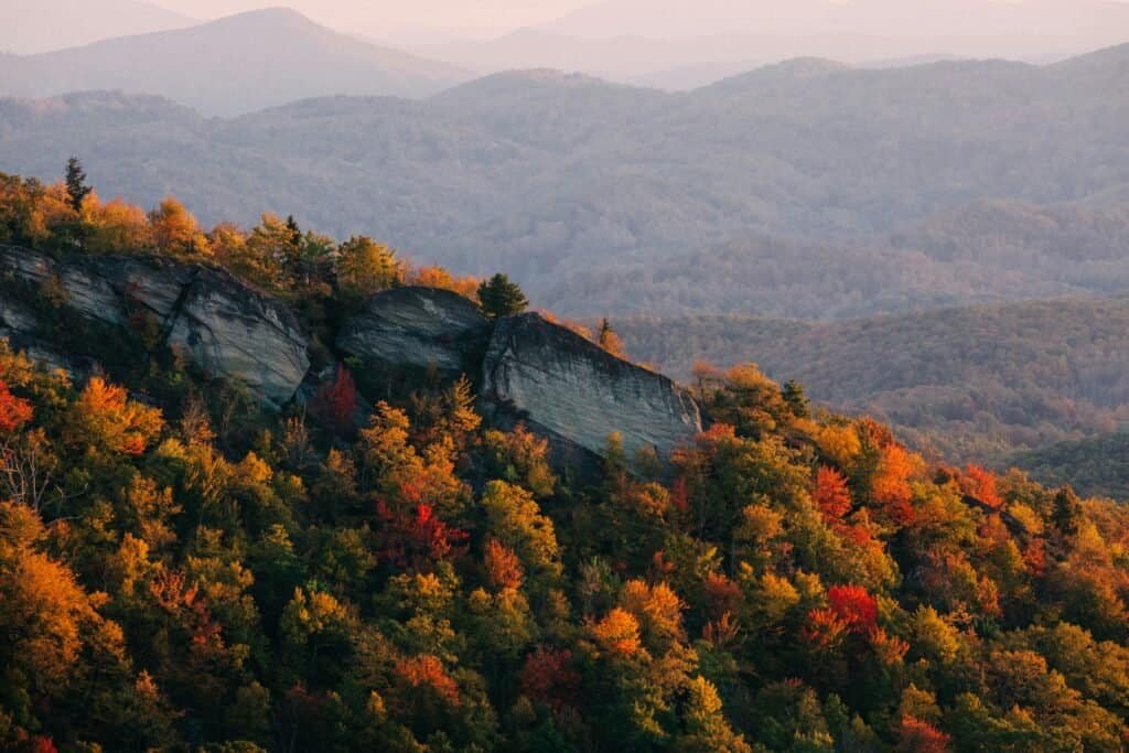 A scenic view of a mountain range in the fall