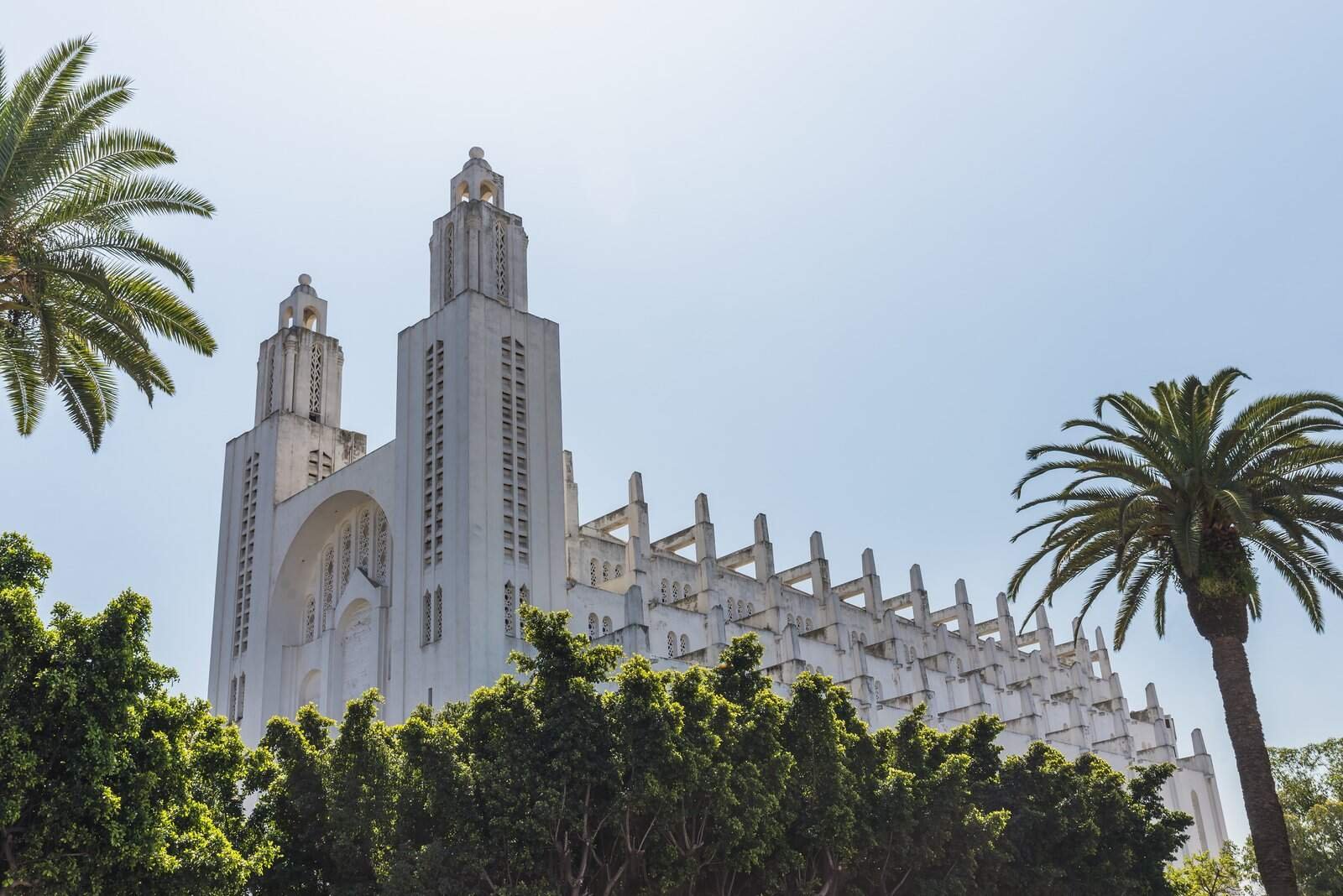 The outside of casablanca cathedral with tree in Casablanca, Morocco