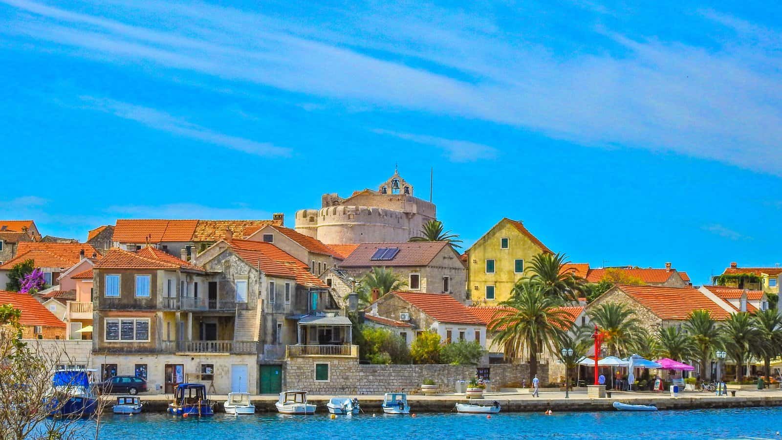 City panorama, view of the monuments of vrboska, attractions on the island of hvar, moored boats in the bay